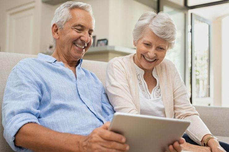 Seniors using digital tablet