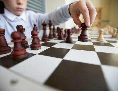 Boy making chess move