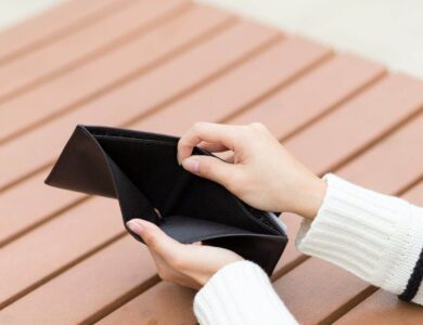 Woman holding an empty wallet