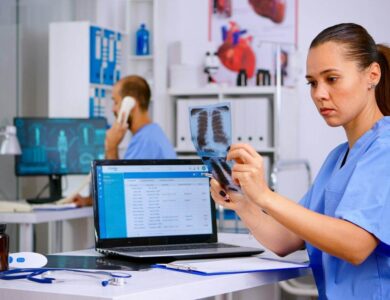 Medical doctor nurse holding and analysing radiography