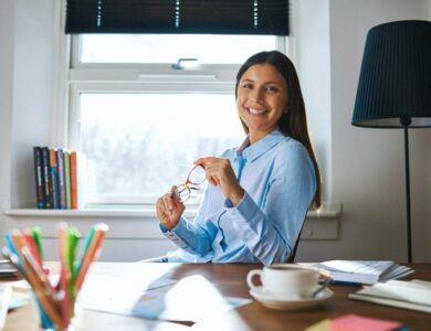 Smiling woman at desk in home office