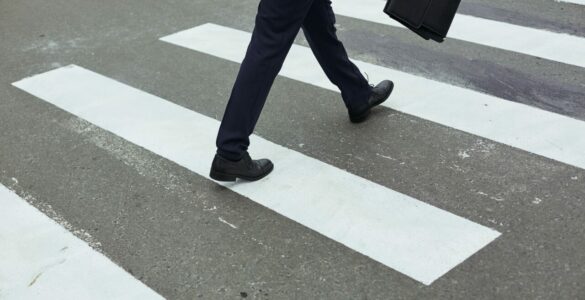 Businessman crossing road